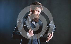 Retro fashion hat. Man with hat. Vintage fashion. Man well groomed bearded gentleman on dark background. Male fashion