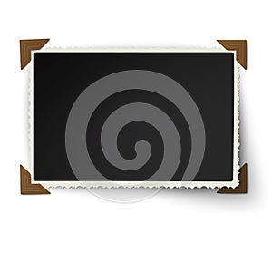 Retro figured edges photo frame with one not fixed turned up corner in vintage brown photo corners isolated on white background.