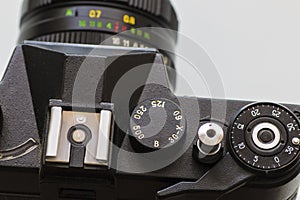 Retro film photo camera isolated over white background