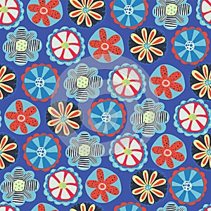 Retro flower seamless vector background. 1960s, 1970s floral design. Red, blue, and yellow doodle flowers on a blue background.