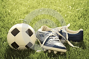 Retro football scene Stud shoe and ball on grass