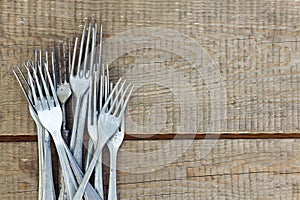 Retro forks on wooden table photo