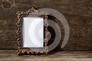 Retro frame for photo on wooden