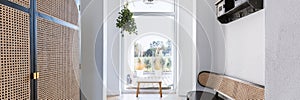 Retro furniture in elegant bright corridor of trendy hom