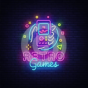 Retro Games Vector Logo. Retro geek gaming gamepad in hand neon sign, modern trend design, vivid vector illustration