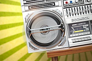 Retro ghetto blaster boombox, radio and audio tape recorder on vintage background