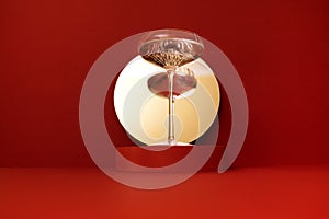 Retro glass of sparkling champagne is reflected in the mirror. Holliday concept photo