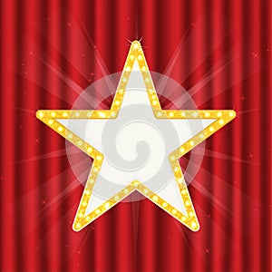 Retro gold star. Vintage frame with lights isolated on red curtain