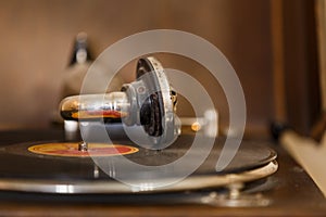 Retro gramophone with vinyl disc on it