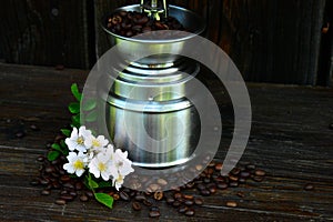 Retro grinder, coffe beens with Cherry blossoms