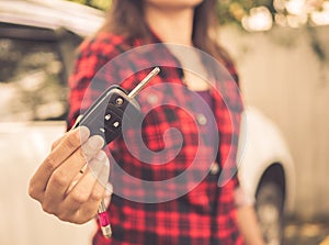 Retro hand holding the remote control car alarm systems