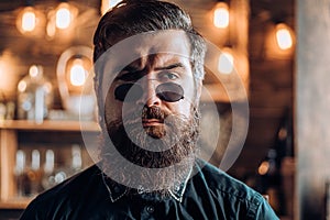 Retro hipster man. Vintage stylish bearded man in retro glasess. Fashion portrait of bearded man. Hipster guy looking