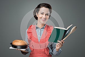 Retro housewife with cookbook