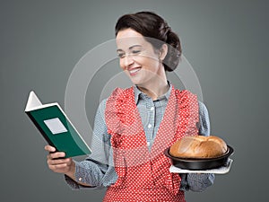 Retro housewife with cookbook