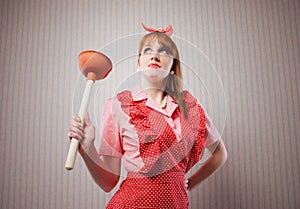 Housewife with plunger photo