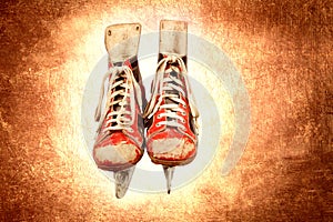 Retro ice skates on leather textured background