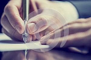 Retro image of a man writing a note