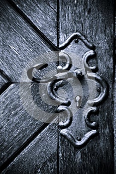 Retro keyhole in old wooden door