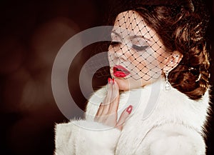 Retro lady portrait. Beautiful Woman in Luxury Fur Coat. Coquette