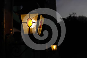 Retro lantern in the dark on night street. Lantern light