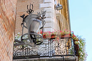 Retro lantern on the wall of ancient building on Cavour square i