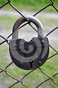 Retro lock on netting fence