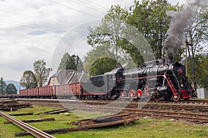 Retro locomotive with freight cars