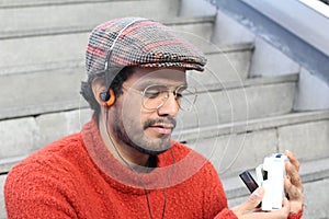 Retro looking guy listening to music