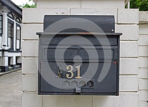 Retro looking rustic outdoor wall attached letter box