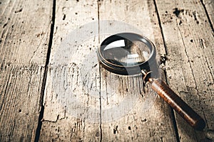 a retro magnifying glass on a wooden table