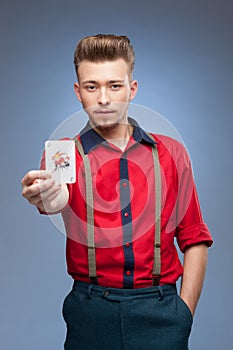 Retro man holding Jocker card