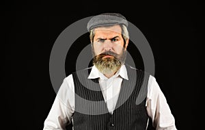 Retro man in peaked cap. Portrait of mature man in victorian gangster outfit. bearded man hipster isolated on black