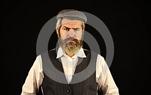 retro man in peaked cap. Portrait of mature man in victorian gangster outfit. bearded man hipster isolated on black