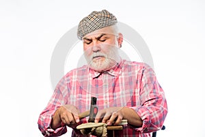 Retro man repair shoes with hammer. Cobbler workmanship. mature shoemaker in workshop make shoes. shoemaker at work