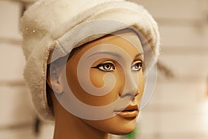 Retro mannequin head showing a winter cap