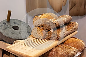 Retro mechanical stone mill and craft bakery bread