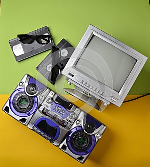 Retro media technologies. Entertainment 80s. Black white lamp TV, tape recorder, video cassette, 3d glasses.