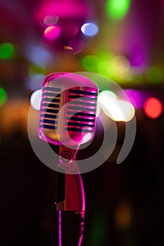 Retro Microphone Against Colorful Bokeh Lights