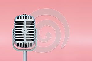 Retro microphone with copy space on pink background