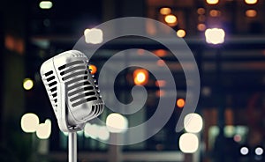 Retro microphone isolated on colorful background