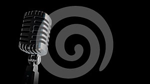 Retro microphone Vintage silver microphone slowly rotating on shiny flickering black background