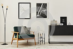 Retro and minimalist compositon of living room interior with design armchair, two mock up poster map, lamp, decoration, white wall