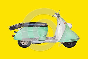 Retro mint with white fifties scooter on a yellow background