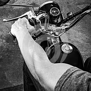 Retro motorbike. Black white picture of a muscular biker