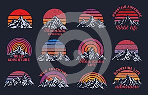 Retro mountains sunset. Mountain peaks with rising sun, wild adventure print and grunge rainbow stripes vector set