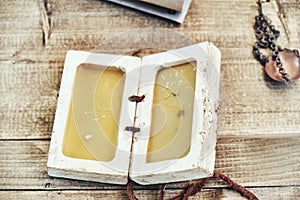 Retro notebook made of wax. Wooden table for writing. Vintage plate for the manuscript