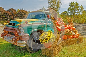 retro old \'56 GMC 350 loaded with Fall agriculture harvest products