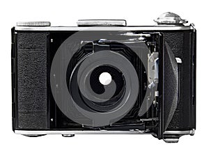 Retro old photo camera on white background. Front view, without lens.