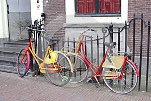 Retro painted students bikes along canal houses, Leiden, Netherlands