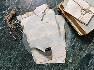 Retro papers and book on detective work table with tools